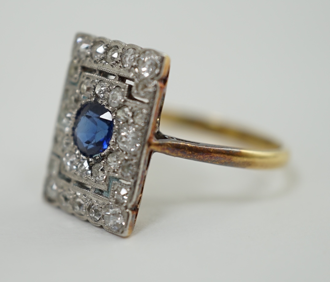 An early 20th century 18ct and platinum, millegrain set sapphire and diamond cluster tablet ring